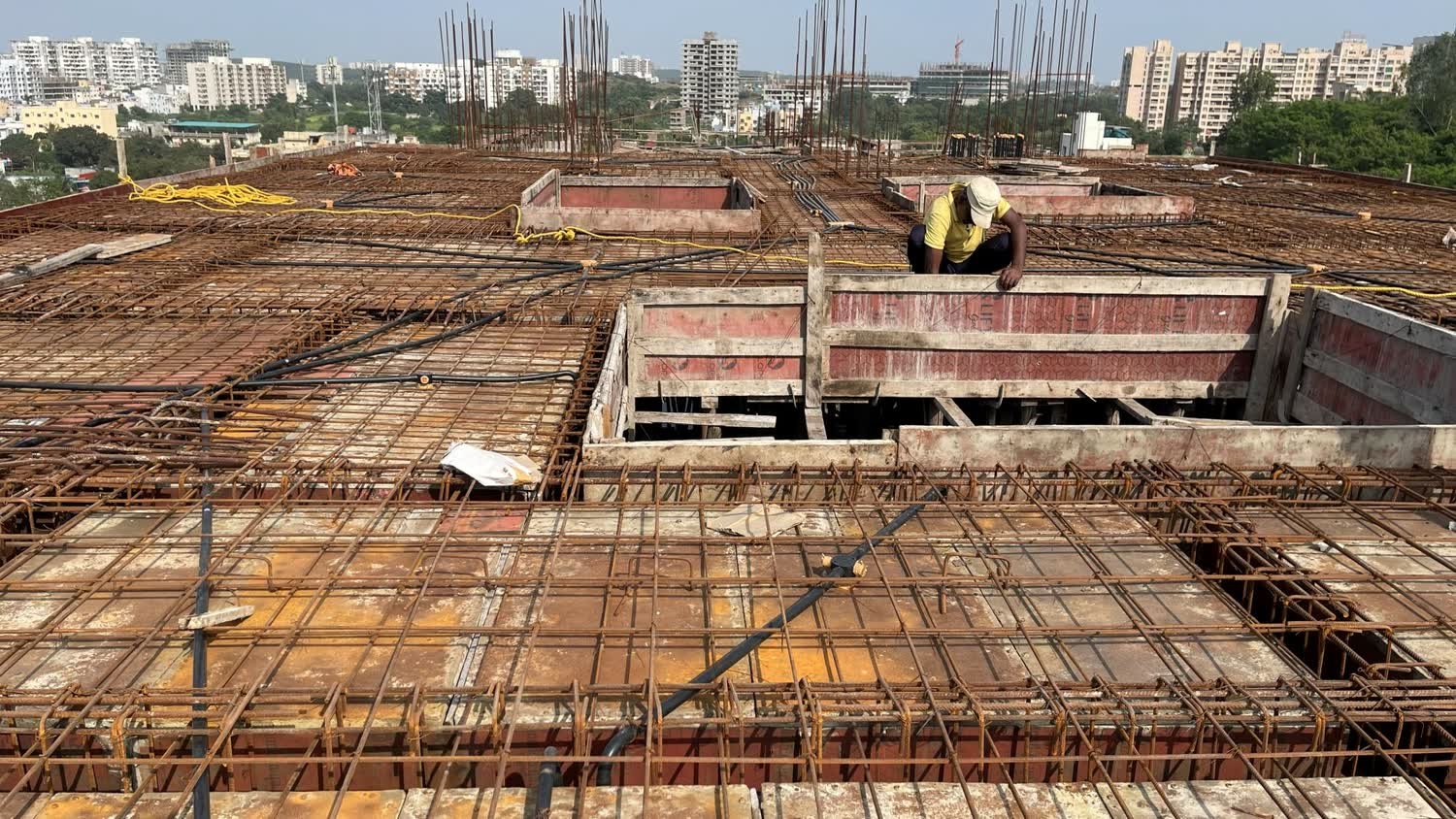 Slab reinforcement in progress above the Pune skyline